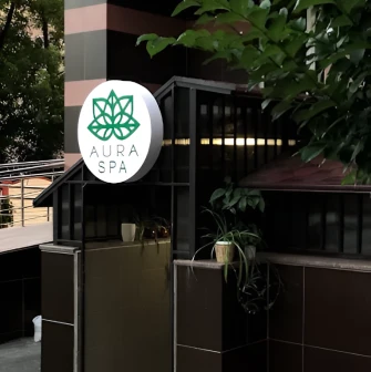 Aura Spa sign at the entrance to the salon complex