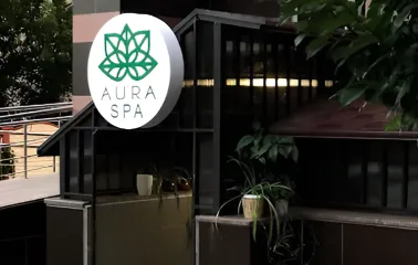 Aura Spa sign at the entrance to the salon complex