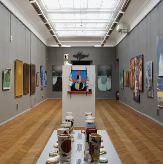 Kyivska Kartynna Halereia in Kyiv - long gallery corridor with skylights, modern art and an installation in the center