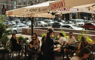 Mimosa Brooklyn Pizza - outdoor terrace with guests dining under umbrellas