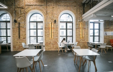 Interior of Peremoga Space in Kyiv with brick walls and large windows