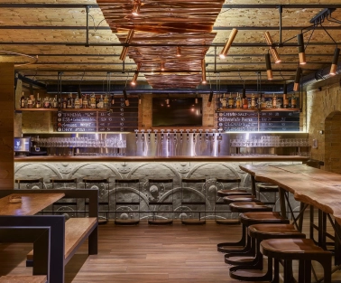 Pub Varvar bar - main bar counter area with numerous beer taps and seating for guests