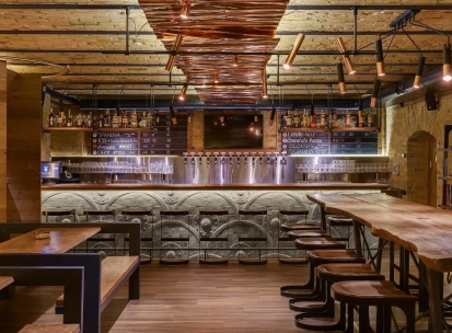 Pub Varvar bar - main bar counter area with numerous beer taps and seating for guests