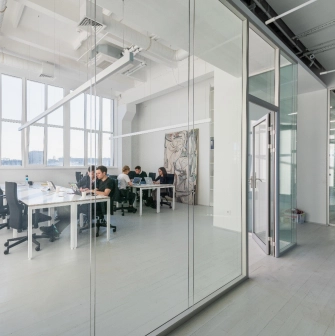 Meeting room behind a glass partition at Kooperativ in Kyiv