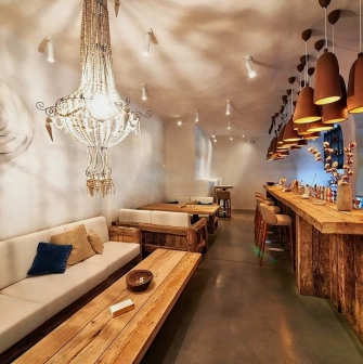 SHO - ground floor dining area showcasing the long main bar and serving counter