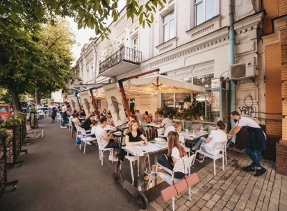 Chornomorka - street terrace with tables and umbrellas