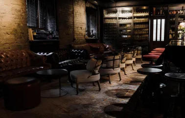 Beatnik Bar - intimate dining tables set with drinks in a cozy corner