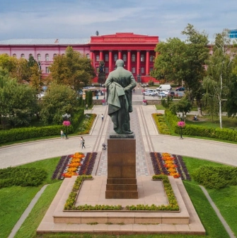 Monument to Taras Shevchenko and the red building of the university in Kyiv