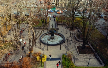 Golden Gate in Kyiv - view through the gate towards a small square with a fountain and surrounding trees