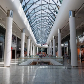Ocean Plaza in Kyiv is a spacious hall with a high geometric glass roof filled with shops