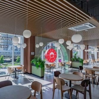 Restaurant Puzata Hata - bright dining area with large windows and the red Puzata Hata logo
