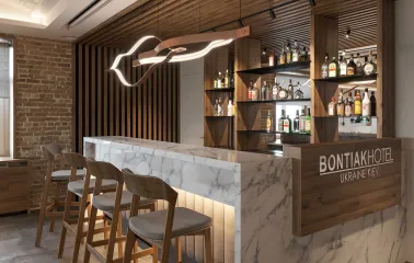 Bar counter and shelves with drinks in the Bontiak Hotel restaurant in Kyiv