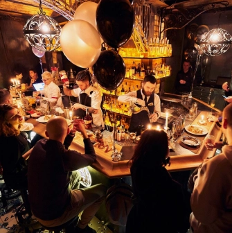 BarmanDictat - close-up view of the bar counter with bartender working