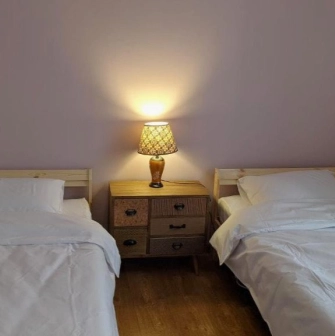 Room with two single beds at Kashtan Guest House in Kyiv