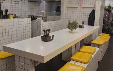 Fruit+Veg Sandwich - minimalist tiled interior with yellow seat cushions