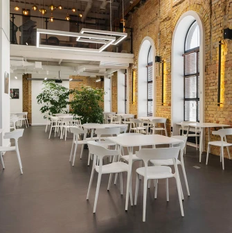 Interior of Peremoga Space in Kyiv with brick walls and large windows