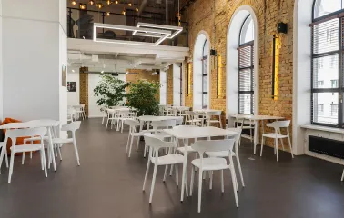 Interior of Peremoga Space in Kyiv with brick walls and large windows