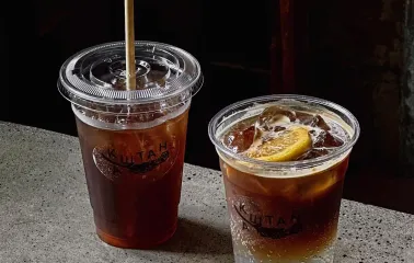 Kashtan - two iced drinks beverages in disposable cups on a counter