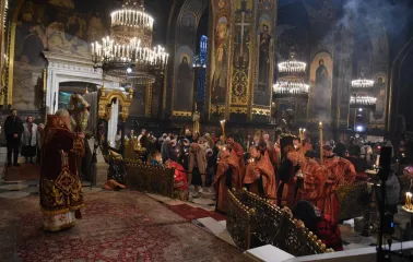 St. Volodymyr's Cathedral in Kyiv - liturgy service with priests in red robes and candles