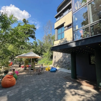 Generator - sunny outdoor terrace with a view and comfortable seating