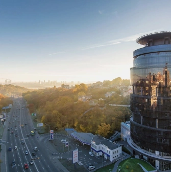 IQ Business Center in Kyiv - round glass facade of a business center with a view of Kyiv