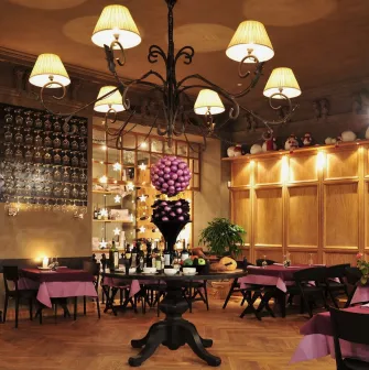 Resraurant Under Wonder - grand dining hall with ornate columns decorative ceiling art