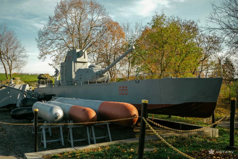 Open-air military equipment exhibition featuring an artillery boat near the War Museum in Kyiv