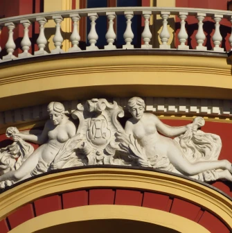 Syrotkin House - elegant white figures of women adorning the hotel facade