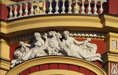 Syrotkin House - elegant white figures of women adorning the hotel facade