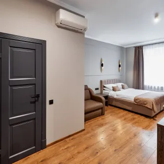 Business-style bedroom in Hotel Classic featuring a comfortable bed and desk