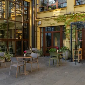 The courtyard of the Bursa Hotel in Kyiv with an outdoor terrace