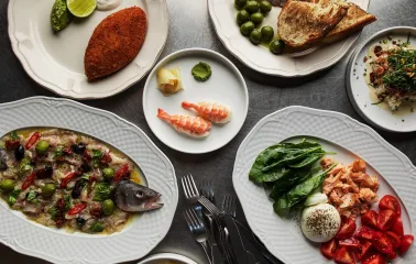 Fish Fetish - close-up view of a plated seafood dish with fish and fresh garnish