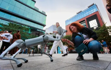 UNIT.City - a Boston Dynamics 'Spot' robot dog walking on a paved walkway