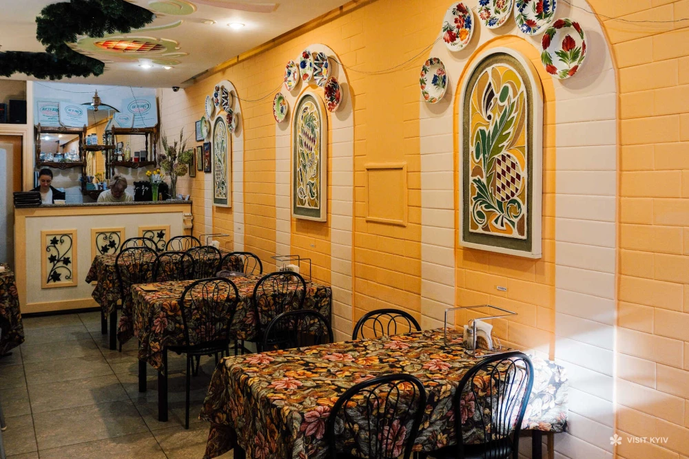 Cozy interior of the Vezuvio pizza hall with yellow walls
