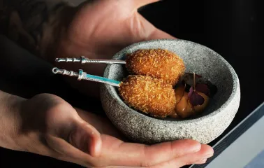 Sansara - intricately decorated snacks arranged on a plate for serving at the bar