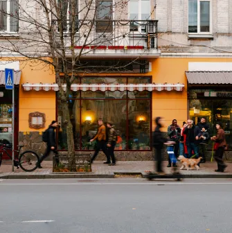 Yaroslava pastry in Kyiv - street view of the bakery on Yaroslaviv Val with people passing by