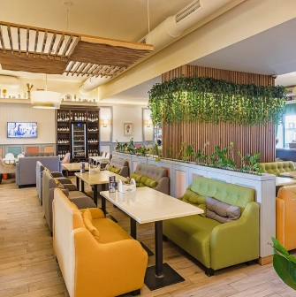Cafe Pesto – a casual dining space with sofas and panoramic windows