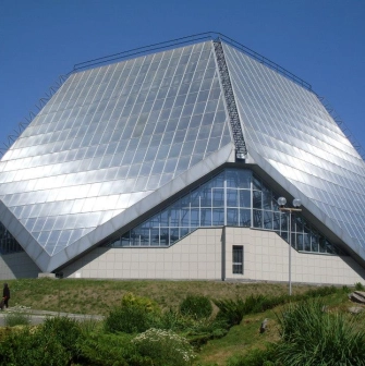 Modern greenhouse building with geometric shapes in the Kyiv Botanical Garden