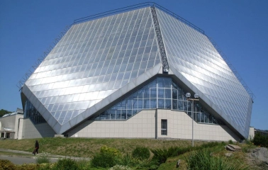 Modern greenhouse building with geometric shapes in the Kyiv Botanical Garden