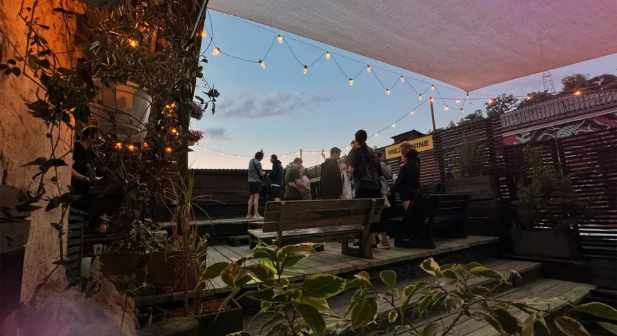 Vechirochka - outdoor terrace with string lights and guests