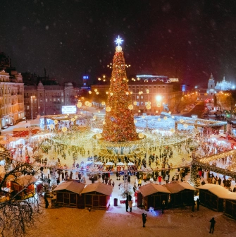 Sofiiska Square in Kyiv - large illuminated Christmas tree and festive market stalls at night