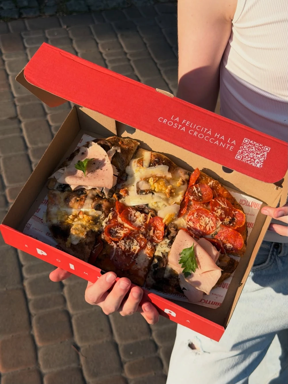 Assorted pizza in a branded Romantica box