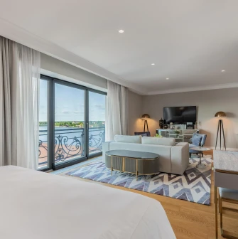 Spacious suite with a lounge area and panoramic windows at the Edem hotel in Kyiv