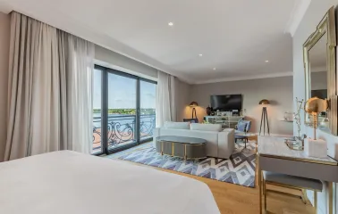 Spacious suite with a lounge area and panoramic windows at the Edem hotel in Kyiv
