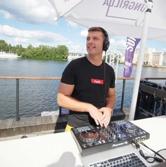 DJ at the mixing console during a party at Sungrilla Beach club