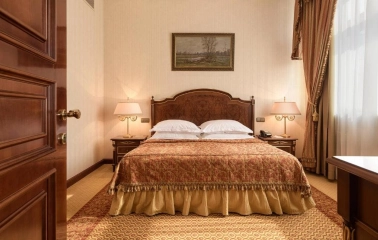 Cozy room with a king-size bed at the Premier Palace Hotel in Kyiv