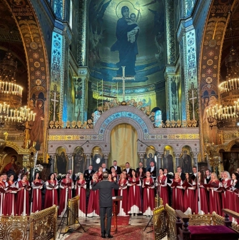 St. Volodymyr's Cathedral in Kyiv - choir in red robes performing in front of altar