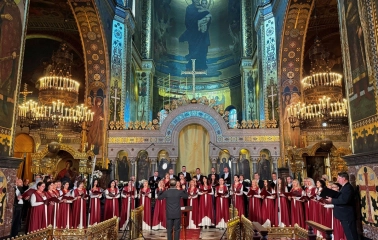 St. Volodymyr's Cathedral in Kyiv - choir in red robes performing in front of altar