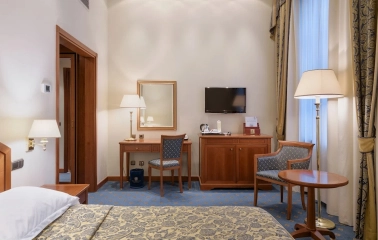 Premier Palace - luxurious hotel room with classic furniture and city view