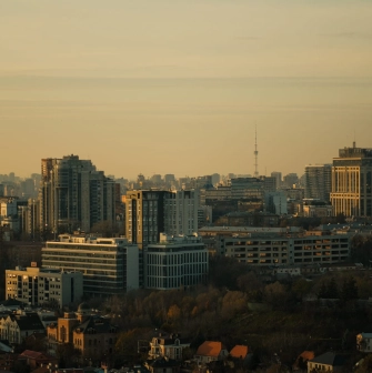 Motherland - panoramic view of the Kyiv city skyline featuring modern high-rise buildings during golden hour